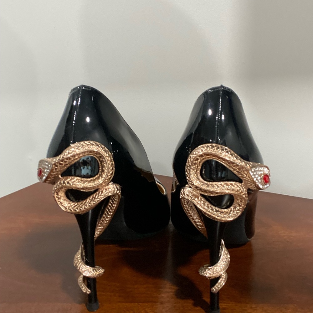 Black heels with snake on heel